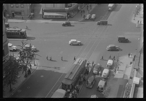 Washington, D.C. A street scene showing street cars crossing at 14th Street and New York Avenue, photographed from a building near the Lotus Club