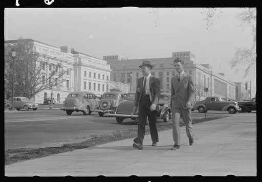 A view of the circular walk leading from the Benjamin Franklin Post Office on the 12th Street side, near Pennsylvania Aveenue, showing pedestrians