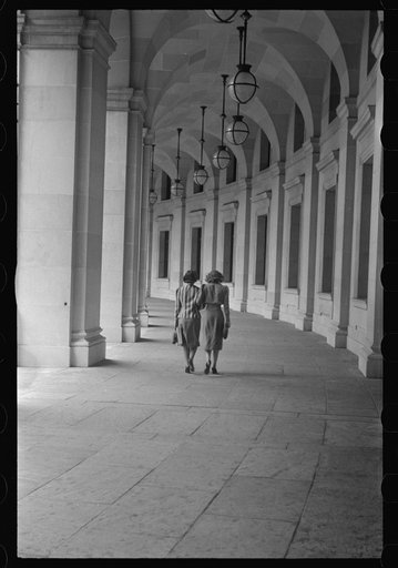 Washington, D.C. A view of the circular walk leading from the Benjamin Franklin post office on the 12th Street side near Pennsylvania Avenue, showing two pedestrians