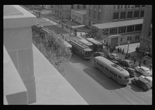 Washington, D.C. A view of 14th Street showing street cars, buses, taxicabs, and pedestrians in front of the U.S. Bureau of Engraving Building, photographed from the U.S. Deptartment of Agriculture South Building