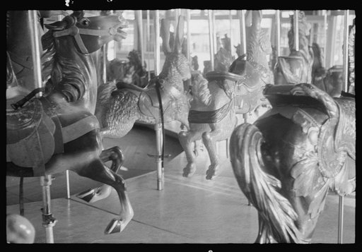 Untitled photo, possibly related to: Glen Echo, Maryland. A small girl enjoying a ride on the merry-go-round at Glen Echo Park