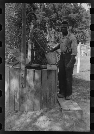 Farmer at well, Saint Mary's County, Maryland