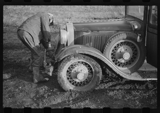 Untitled photo, possibly related to: Oldest Sauer boy cranking family car. Cavalier County, North Dakota