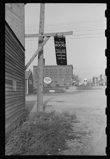 Untitled photo, possibly related to: Metal sign blowing in the wind. Doyon, North Dakota