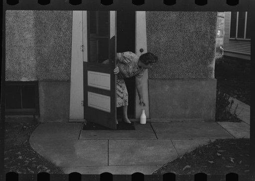 Getting milk at back door. Saint Paul, Minnesota