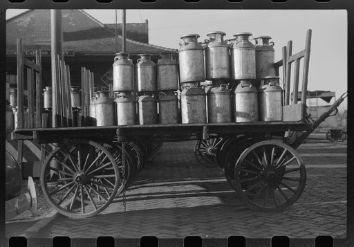 Milk cans at Railroad station. Minot, North Dakota