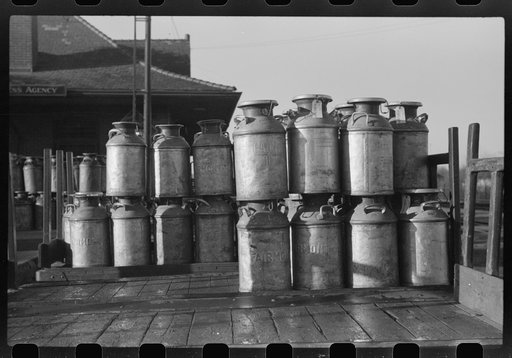 Untitled photo, possibly related to: Milk cans at Railroad station. Minot, North Dakota