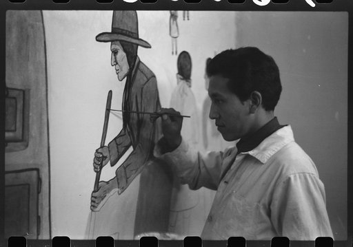 Andrew Standing Soldier, Sioux Indian, painting mural in auditorium, OD School, Pine Ridge, South Dakota