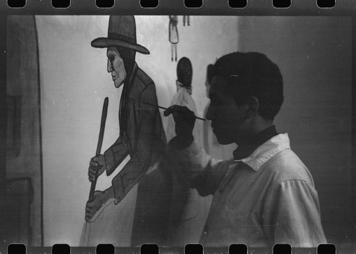 Untitled photo, possibly related to: Andrew Standing Soldier, Sioux Indian, painting mural in auditorium, OD School, Pine Ridge, South Dakota