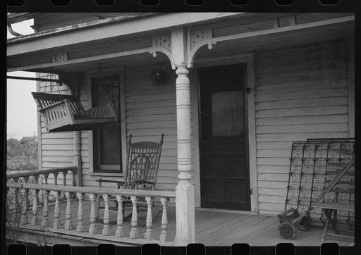 Untitled photo, possibly related to: Mayetta, Kansas. Porch swing up for the winter