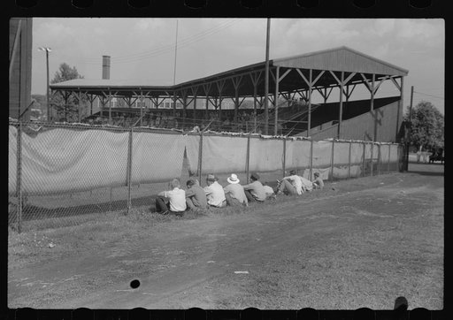 Untitled photo, possibly related to: Watching ballgame. Vincennes, Indiana