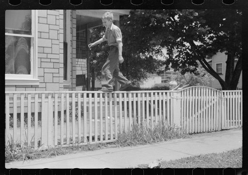 Boys walking fence. Washington, Indiana
