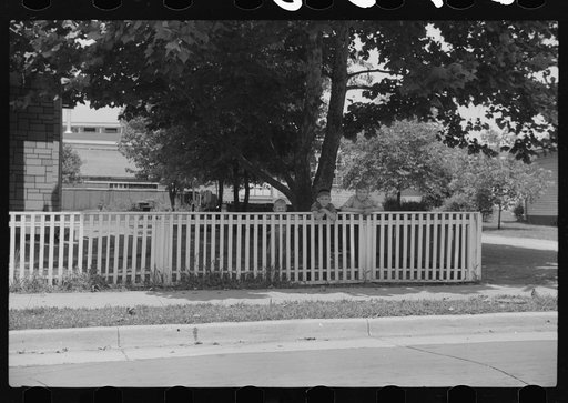 Untitled photo, possibly related to: Boys walking fence. Washington, Indiana