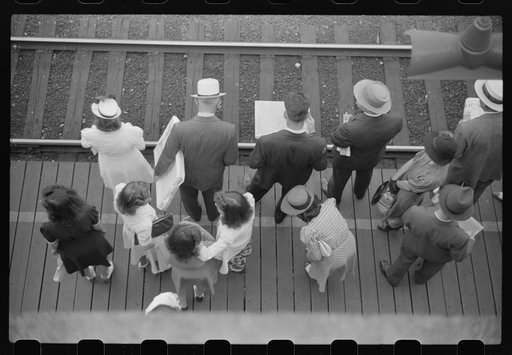 Commuters waiting for south-bound train.  Chicago, Illinois