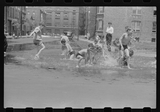 Untitled photo, possibly related to: Cooling off in water from hydrant, Chicago, Illinois
