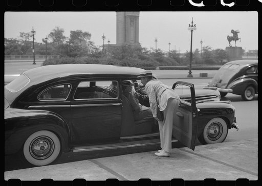 Untitled photo, possibly related to: Car stopped in front of hotel, Chicago, Illinois