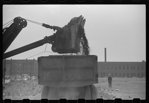 Untitled photo, possibly related to: Steam shovel loading truck, Chicago, Illinois