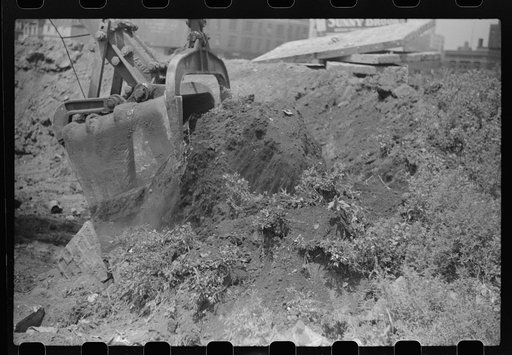 Untitled photo, possibly related to: Steam shovel loading truck, Chicago, Illinois