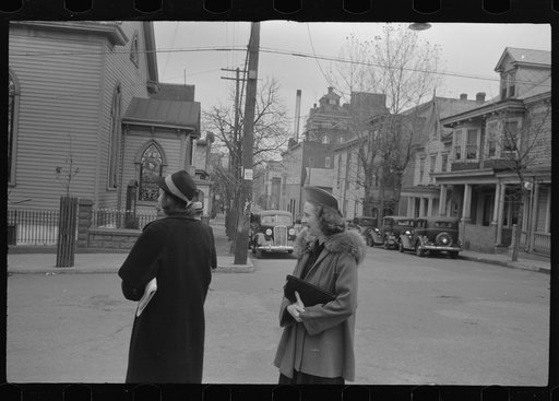 Shenandoah(?), Pennsylvania. Two women on a street corner, near a Protestant church, on Sunday morning