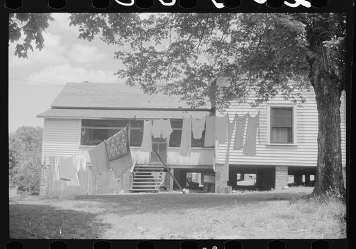 Old company house on wash day. Swepsonville, North Carolina