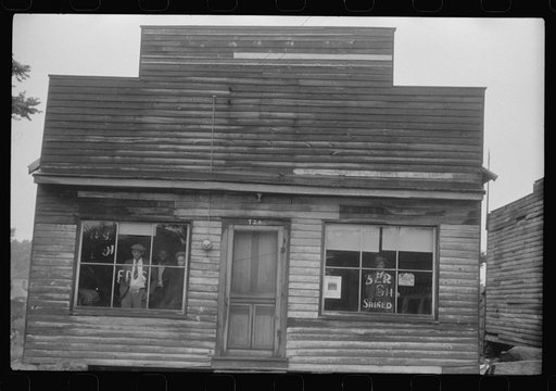 Untitled photo, possibly related to: A combination pool room, barbershop, shoe shine parlor and general hangout for Negroes in Roxboro, North Carolina