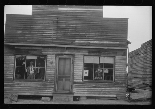 Untitled photo, possibly related to: A combination pool room, barbershop, shoe shine parlor and general hangout for Negroes in Roxboro, North Carolina