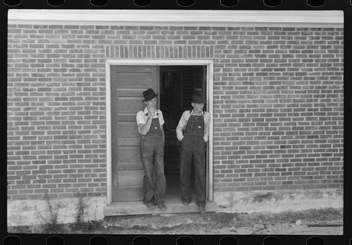 Farmer and his son on election day in Stem, North Carolina