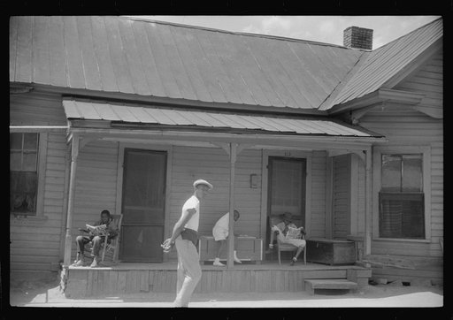 Untitled photo, possibly related to: Negro children reading the comics on Sunday morning, Durham, North Carolina