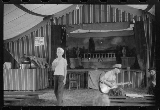 Traveling carnival at Old Trap, North Carolina. This troupe follows the migrants around and stops where there is a large settlement of them. A show generally consists of a band concert and movie and vaudeville