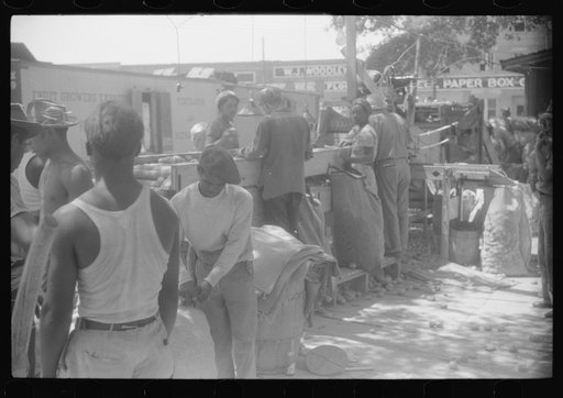 Untitled photo, possibly related to: An outdoor potato grader using migratory labor. At the freight station in Elizabeth City, North Carolina