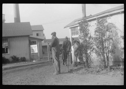 Entrance to Webster Canning Company at Cheriton, Virginia. On payday a policeman hands out the pay