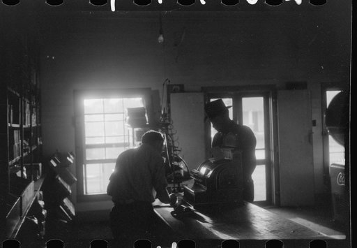 Untitled photo, possibly related to: Migratory agricultural workers buying canned goods for supper at the company store. Belcross, North Carolina