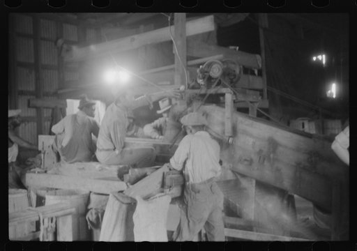 Untitled photo, possibly related to: At the pick table end of the potato grader at Belcross, North Carolina