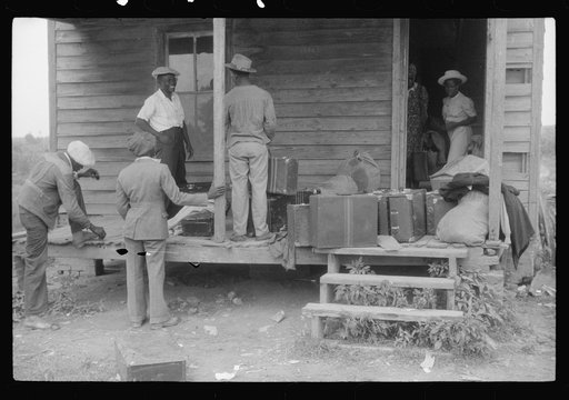 Migratory crew of agricultural workers waiting to leave on their truck from Belcross, North Carolina to Onley, Virginia