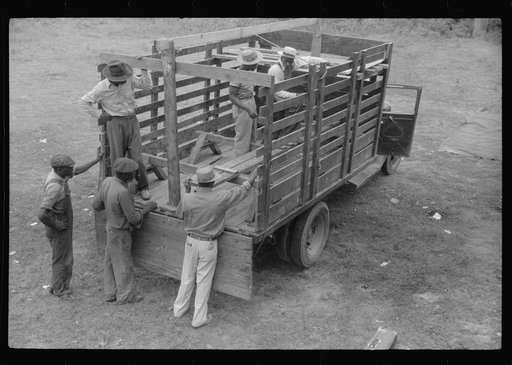 Florida migrants preparing their truck for a trip from Belcross, North Carolina to Onley, Virginia