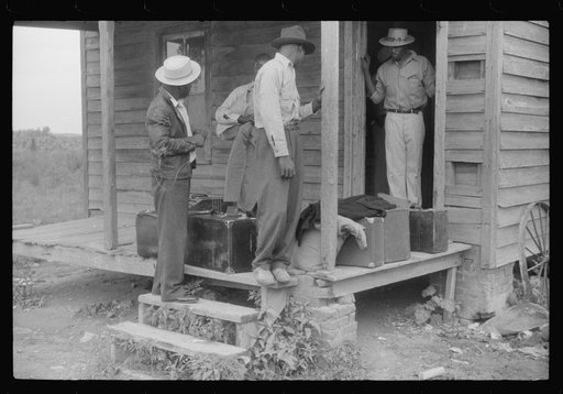 Migrants with their luggage preparing to leave Belcross, North Carolina for another job at Onley, Virginia