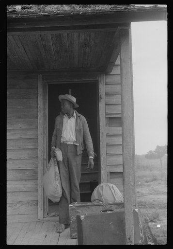 Untitled photo, possibly related to: Migrant packing his bag for a trip from Belcross, North Carolina to another job at Onley, Virgin