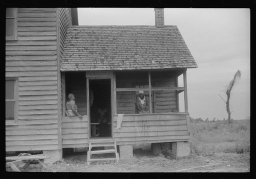 The last bit of washing is done while waiting for the truck to come and take these migratory workers and thirty-three others to another job at Onley, Virginia. They have been picking potatoes at Belcross, North Carolina