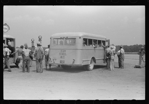 Untitled photo, possibly related to: Migratory bean pickers being loaded into school buses for transportation to the bean fields. Statensville, Delaware