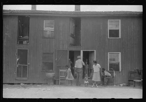 Permanent residents at the houses of W.T. Handy's packinghouse, Crisfield, Maryland. They work on canning vegetables for part of the season and oysters the rest
