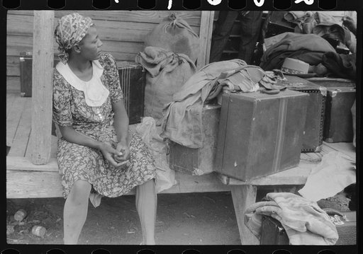 Georgia migratory agricultural worker waiting for the truck which will take her to another job at Onley, Virginia. Near Belcross, North Carolina