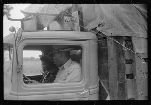 The driver is Sam Cooper, the leader of a crew of thirty-five Florida migratory agricultural workers. They have just finished picking potatoes near Belcross, North Carolina and he has found them another job at Onley, Virginia