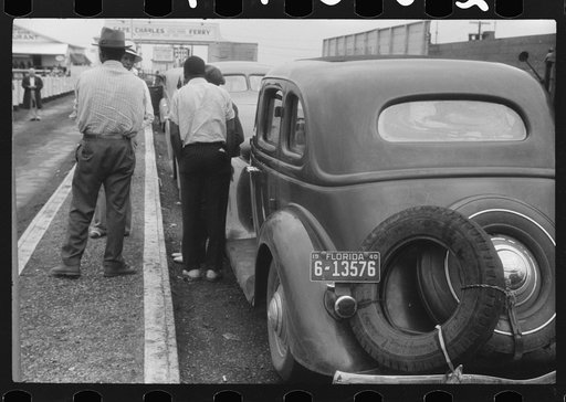 Untitled photo, possibly related to: Florida migratory workers at the Norfolk end of the Norfolk-Cape Charles Ferry. They are on their way with the rest of the occupants of the truck to pick potatoes and onions at Onley, Virginia