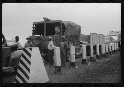 Untitled photo, possibly related to: Florida migratory workers at the Norfolk end of the Norfolk-Cape Charles Ferry. They are on their way with the rest of the occupants of the truck to pick potatoes and onions at Onley, Virginia