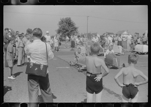 The winners of the soapbox auto race during July 4th celebration at Salisbury have their pictures taken for the local paper. Salisbury, Maryland