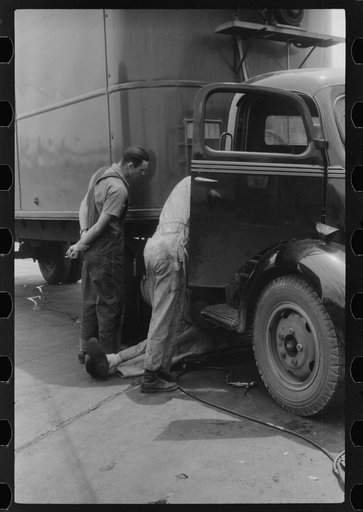 Untitled photo, possibly related to: Attendant at truck service station on U.S. 1 (New York Avenue), Washington, D.C.