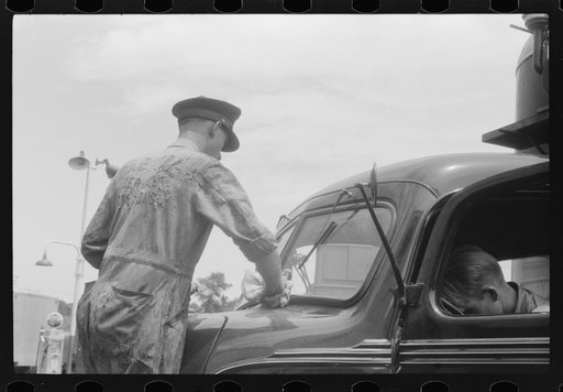 Untitled photo, possibly related to: Attendant at truck service station on U.S. 1 (New York Avenue) in Washington, D.C.