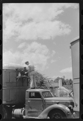 Untitled photo, possibly related to: Starting up the motor of a refrigerator truck at a truck service station on U.S. 1 (New York Avenue), Washington, D.C.