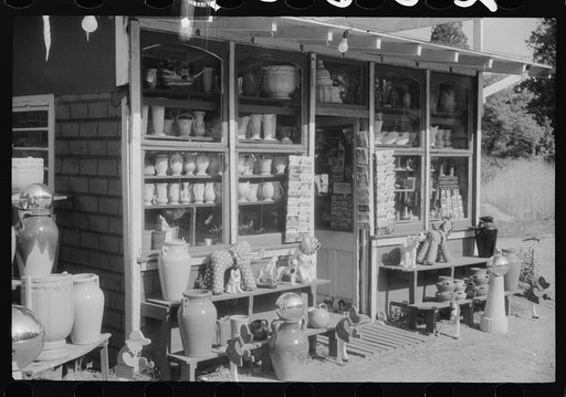 Untitled photo, possibly related to: Novelty store and proprietor along U.S. 1, a few miles north of Washington, D.C.