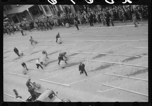 The annual barrel rolling contest. Each barrel has two hundred pounds in it. Presque Isle, Maine
